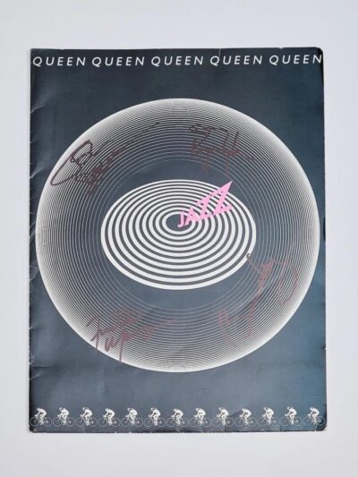 Album cover with circular design and signatures.