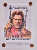 Vintage movie poster with armed cowboy illustration.