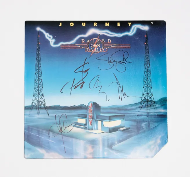 Album cover with signatures and radio towers.