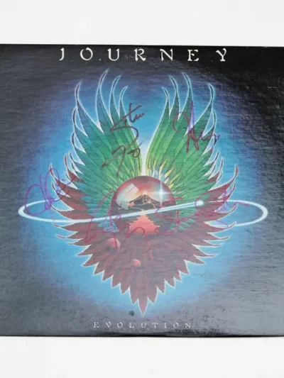 Journey Evolution album cover with signature.