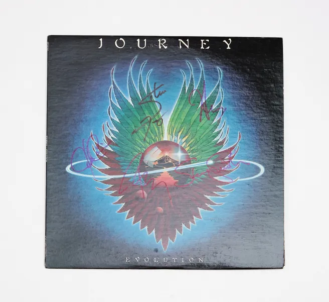 Journey Evolution album cover with signature.