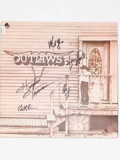 Vintage Outlaws album cover with signatures.