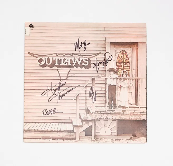 Vintage Outlaws album cover with signatures.