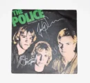 The Police album cover with signatures.