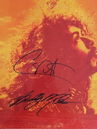 Autographed orange album cover with musician profile