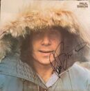 Autographed album cover with person in fur-lined hood