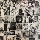 Black-and-white photo collage with scribbled signatures