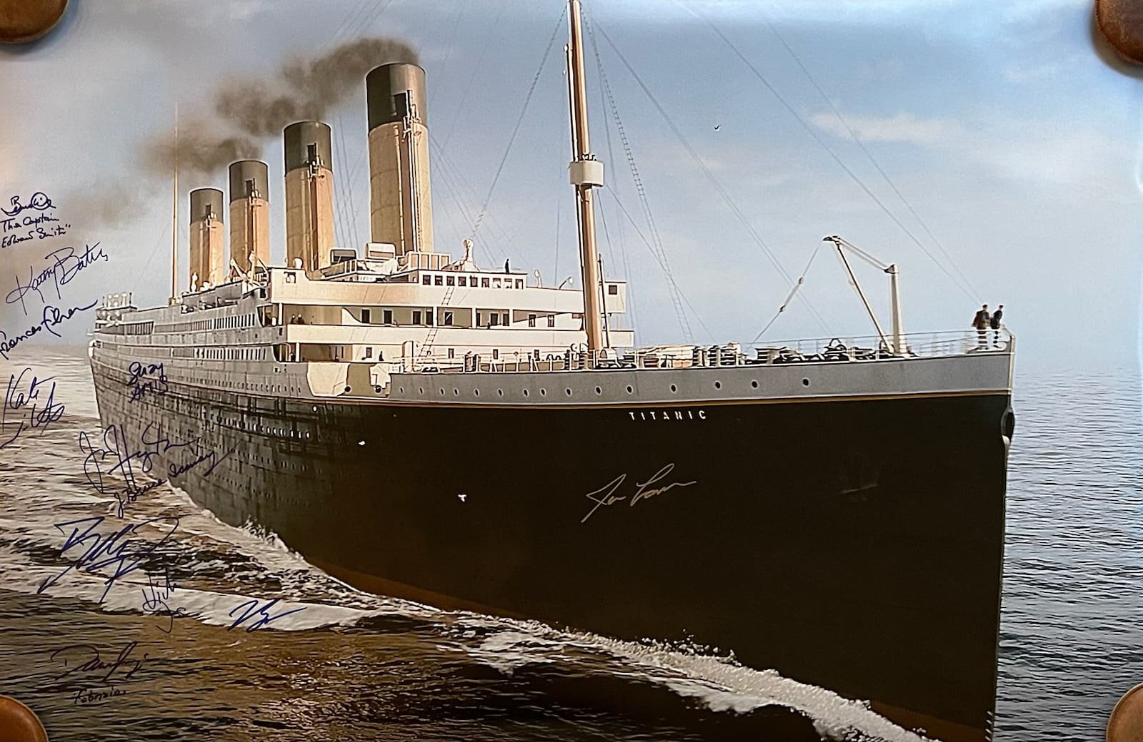 Titanic sailing with autographs on the photograph.
