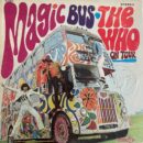 Psychedelic painted double-decker bus with band